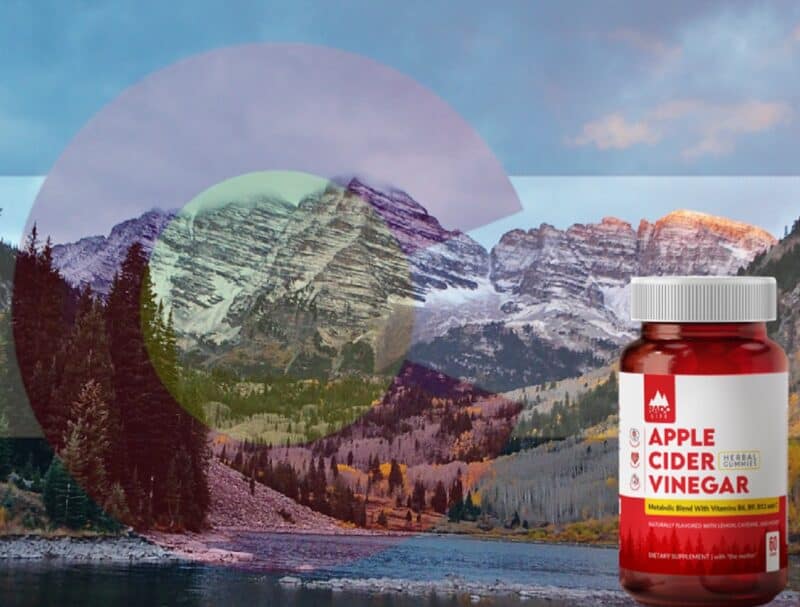 Apple Cider Vinegar Supplement bottle by Rado Life featuring vitamins B6, B9, B12, and C, along with natural lemon, honey, cayenne, ginger, and apple cider vinegar with the mother. Scenic river backdrop with mountains and a transparent Colorado flag overlay.